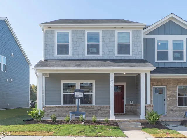 front view of a house with a yard