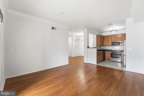 a kitchen with appliances and cabinets
