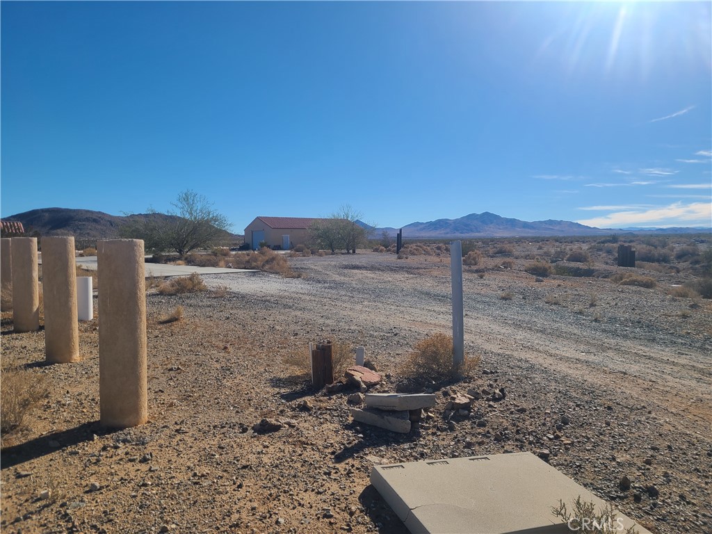29001 Frontier Road Barstow, CA 92311 - Photo 1 of 1 a view of a backyard with wooden fence