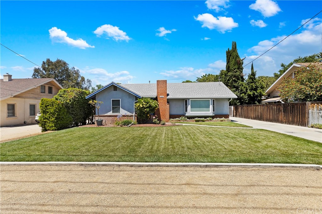 4237 Rubidoux Avenue Riverside, CA 92506 - Photo 1 of 1 a front view of a house with a garden
