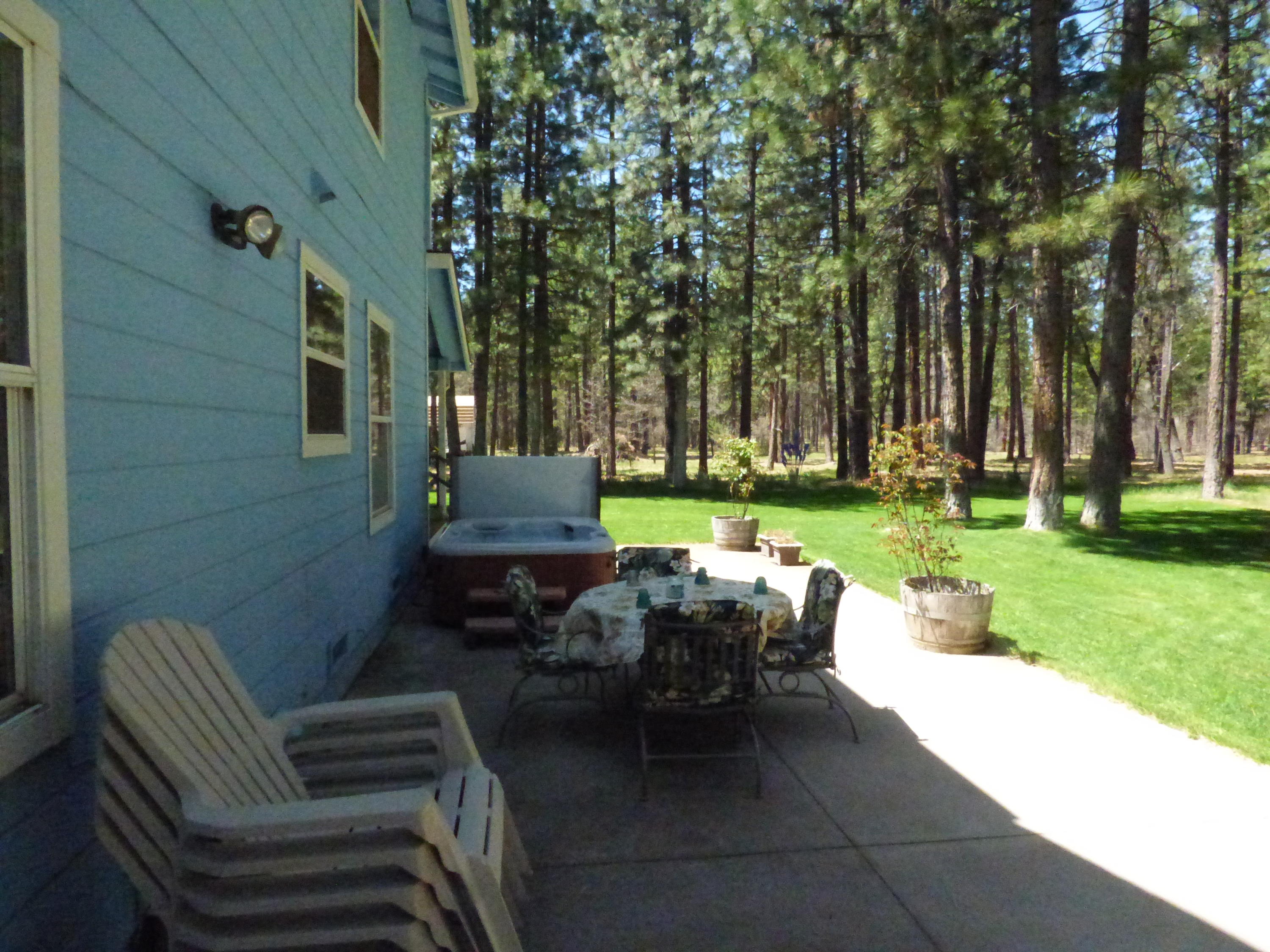 50 Red Rock Road McArthur, CA 96056 - Photo 22 of 24 a backyard of a house with outdoor seating