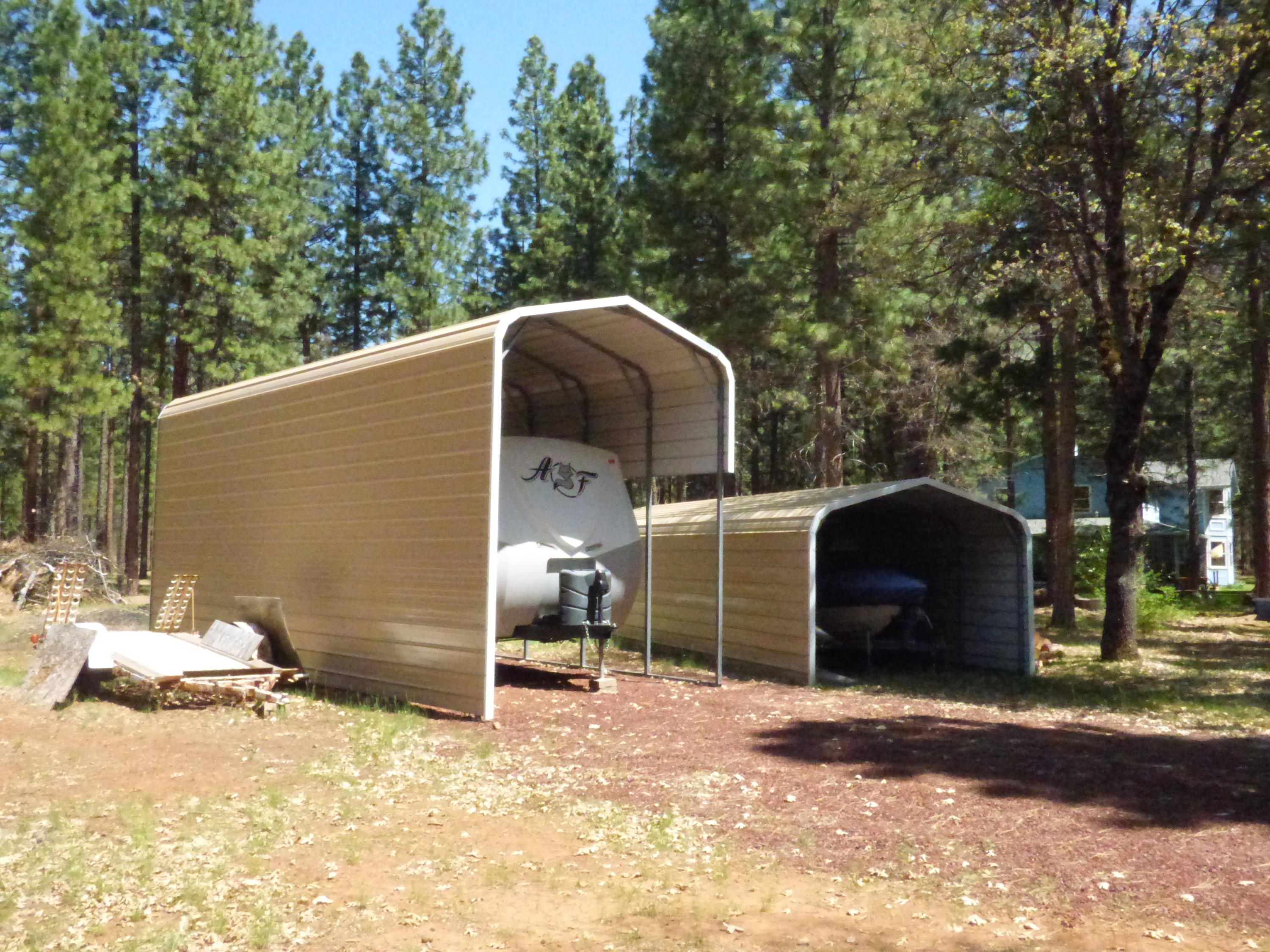50 Red Rock Road McArthur, CA 96056 - Photo 5 of 24 a backyard of a house with barbeque oven and trees