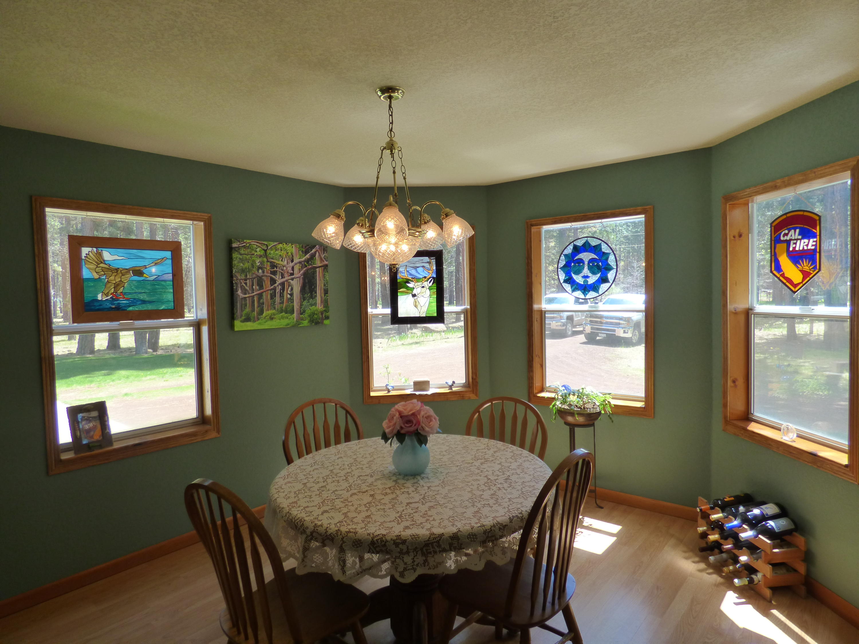 50 Red Rock Road McArthur, CA 96056 - Photo 8 of 24 a view of a dining room with furniture a chandelier and window