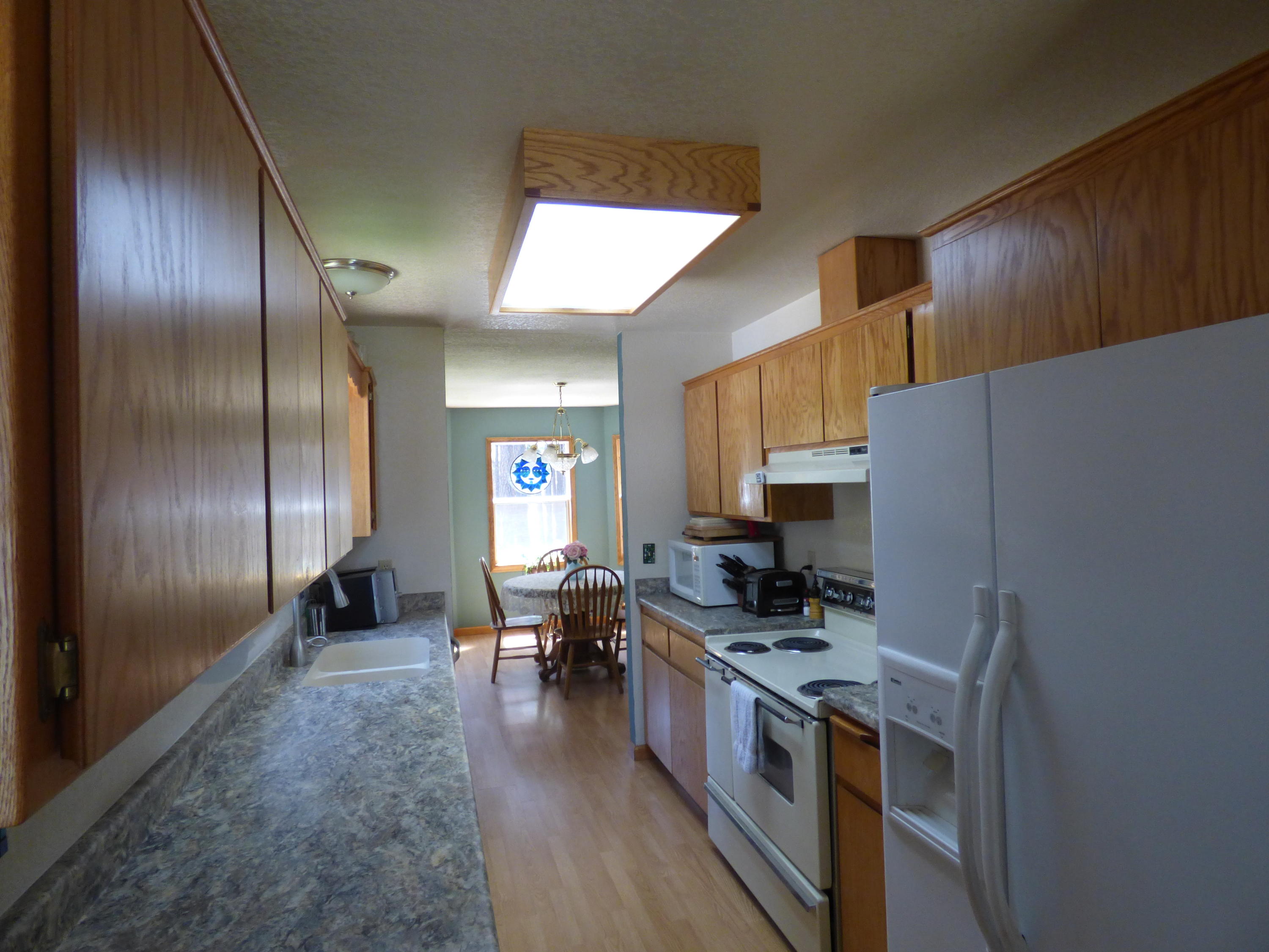 50 Red Rock Road McArthur, CA 96056 - Photo 9 of 24 a kitchen with granite countertop stainless steel appliances lots of counter top space and cabinets