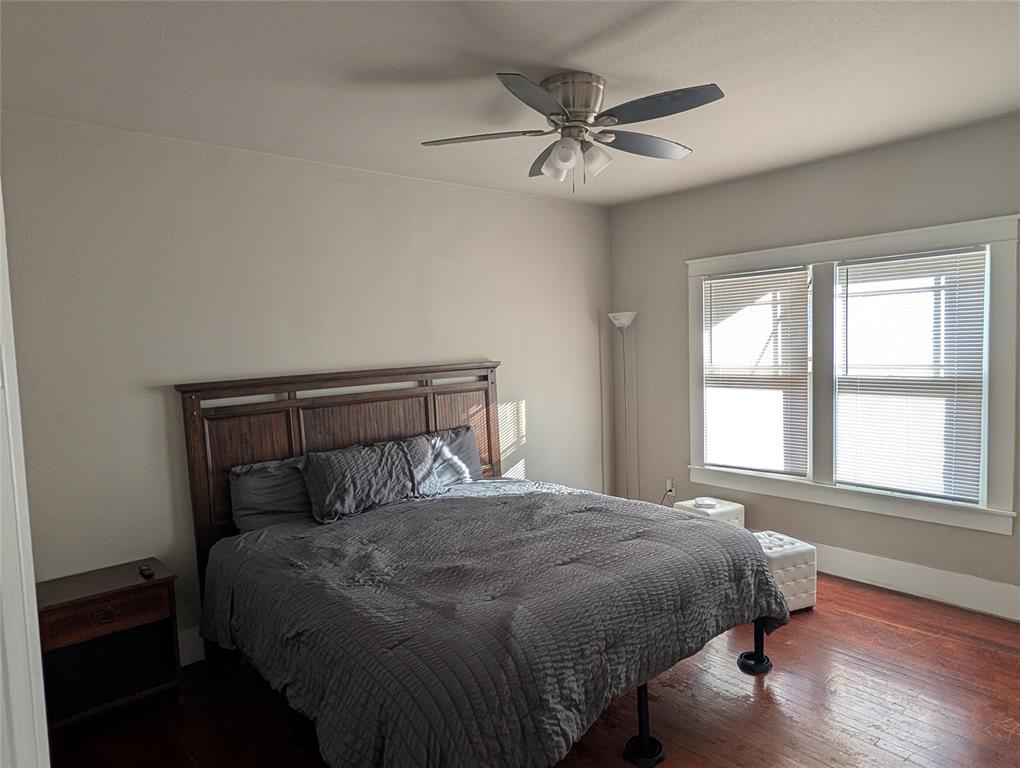 849 Grape Street Abilene, TX 79601 - Photo 8 of 11 a bedroom with a bed and a window