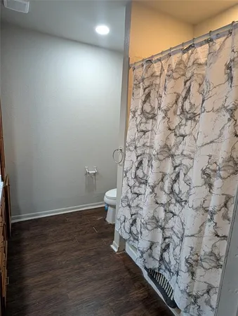 a bathroom with a shower curtain