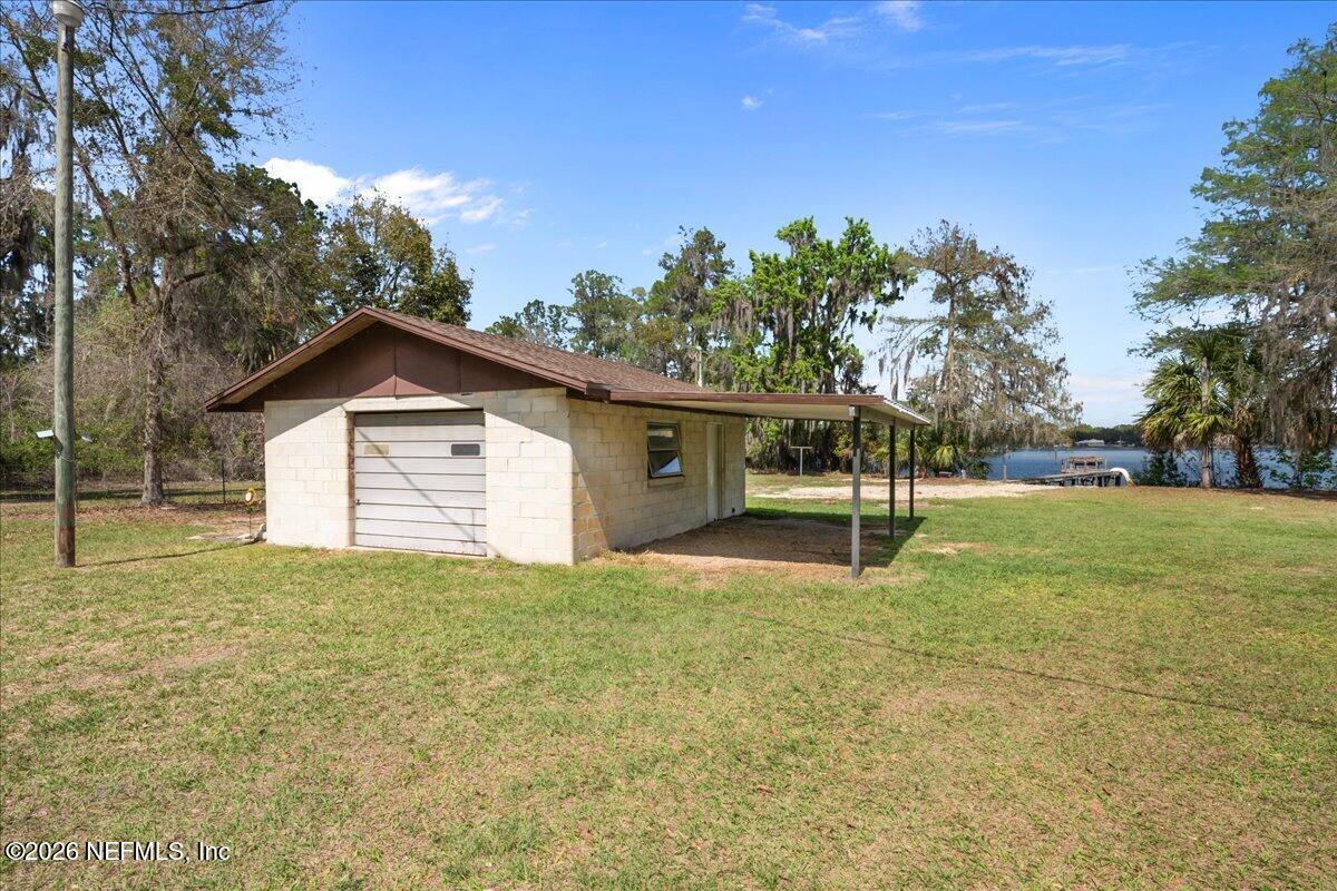 986 Highway 20 Interlachen, FL 32148 - Photo 13 of 53 a view of a house with backyard and trees