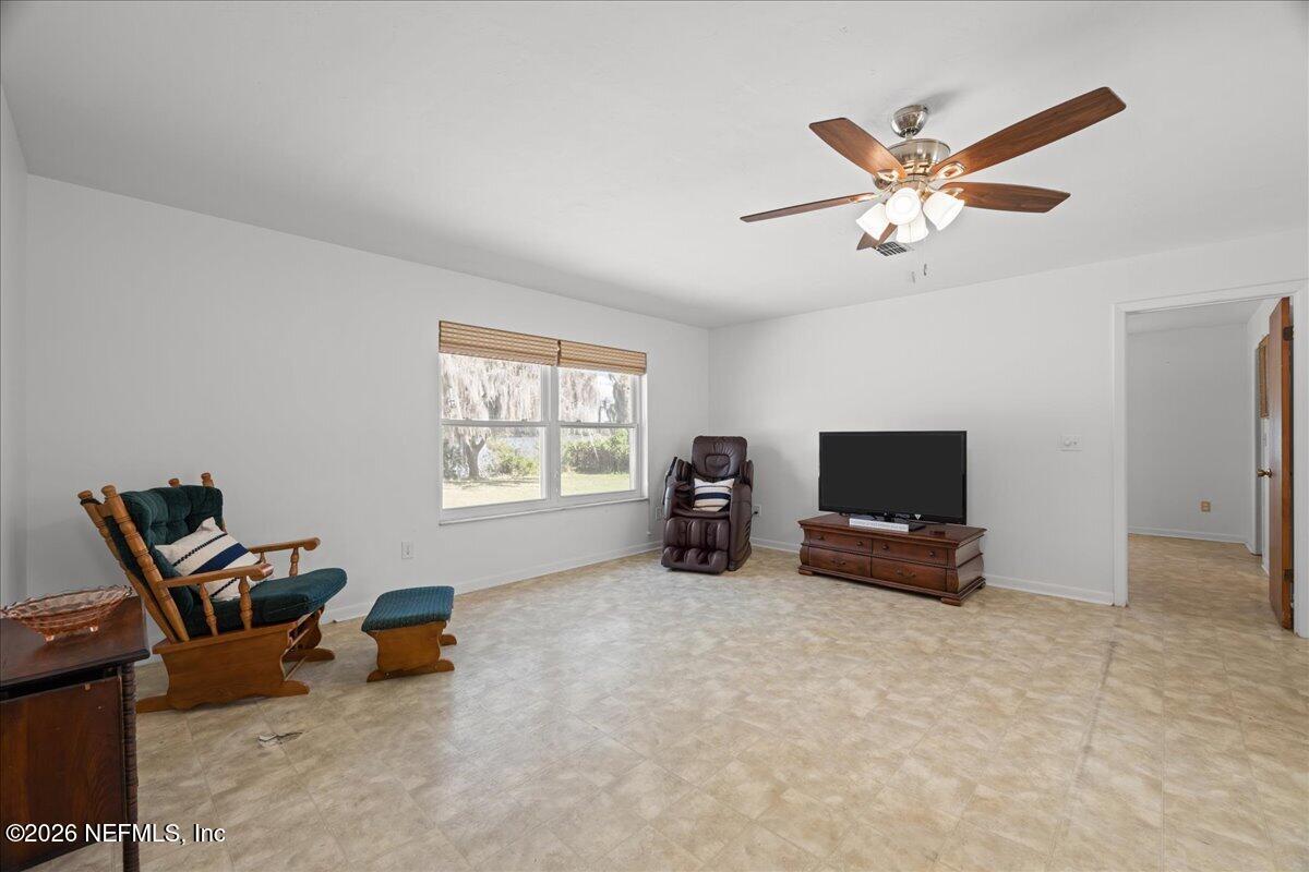 986 Highway 20 Interlachen, FL 32148 - Photo 15 of 53 a view of a livingroom with furniture and a flat screen tv