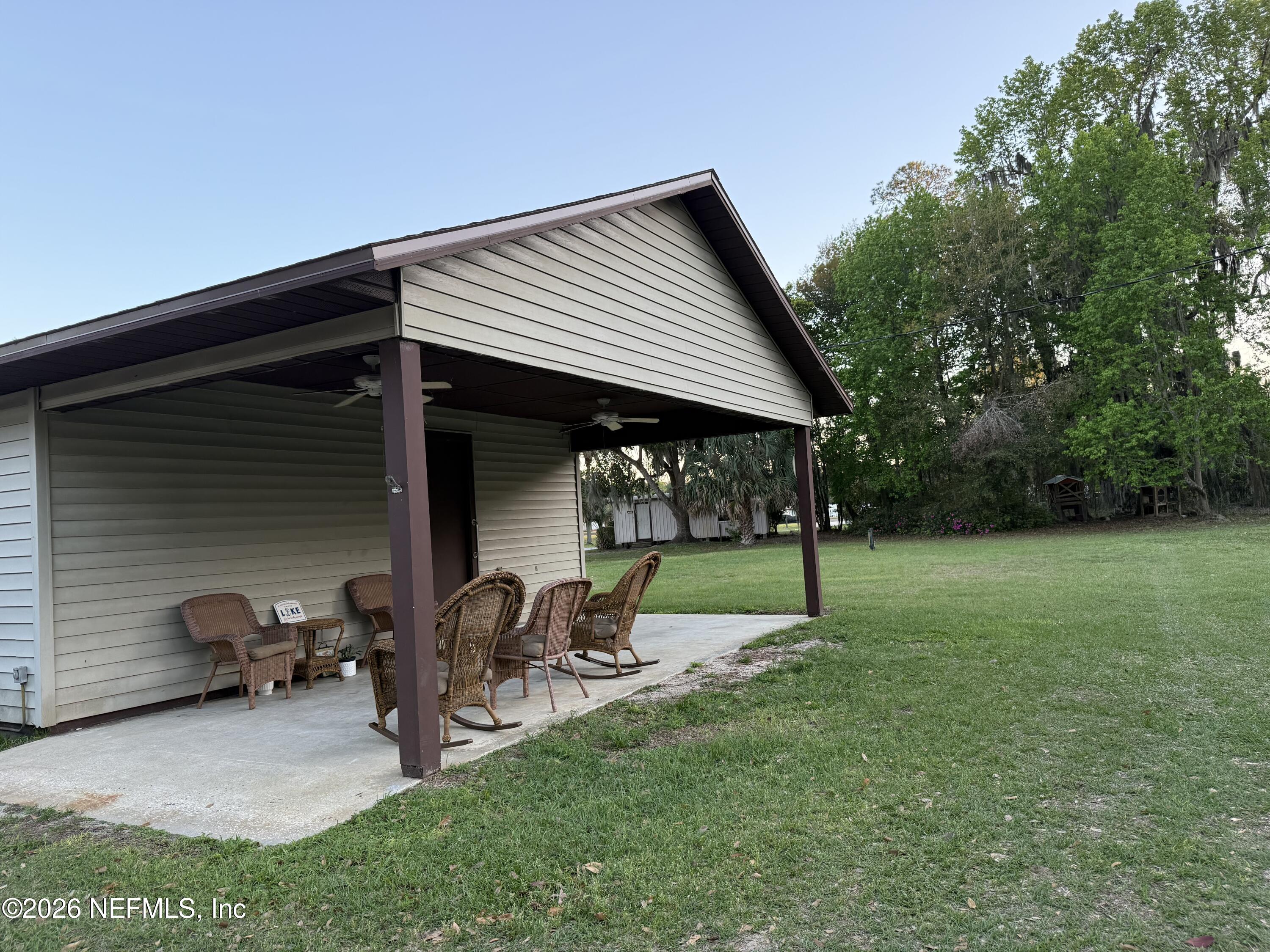 986 Highway 20 Interlachen, FL 32148 - Photo 20 of 53 a view of house with backyard and furniture
