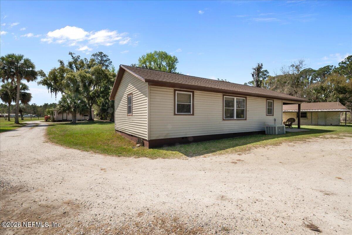 986 Highway 20 Interlachen, FL 32148 - Photo 22 of 53 a view of a house with a backyard