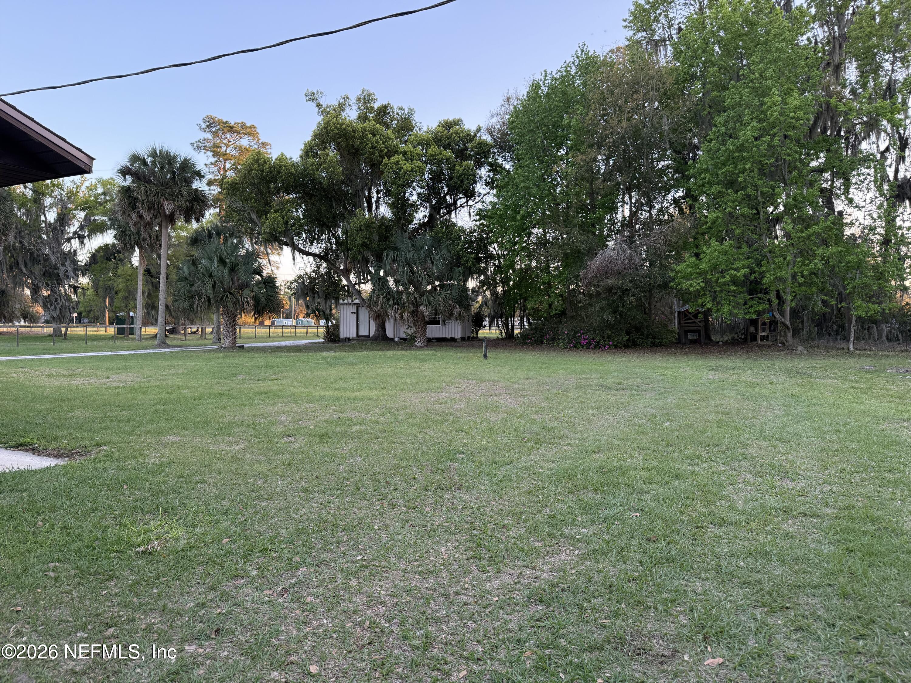 986 Highway 20 Interlachen, FL 32148 - Photo 38 of 48 a view of a field of grass and trees