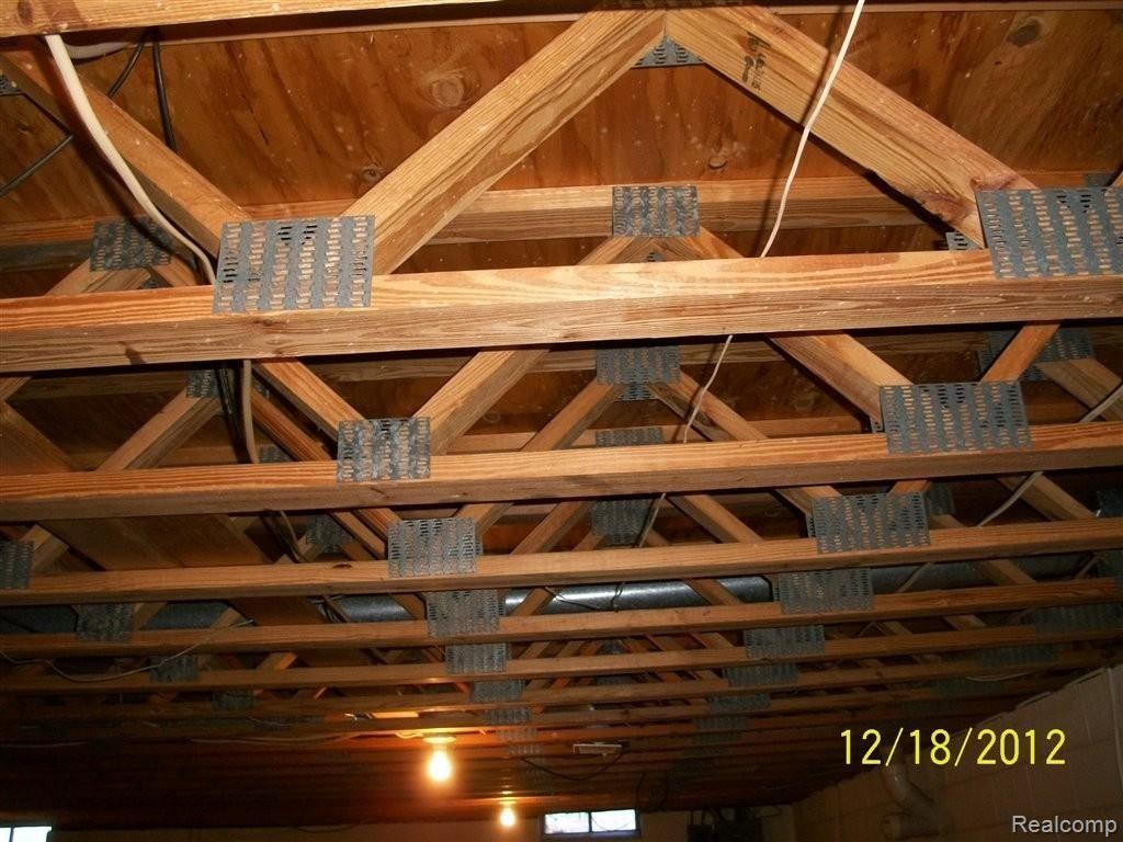 49101 Card Road Macomb, MI 48044 - Photo 14 of 18 trused floor joist for no poles.