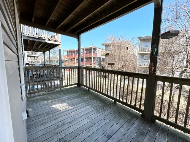 a view of porch with wooden floor
