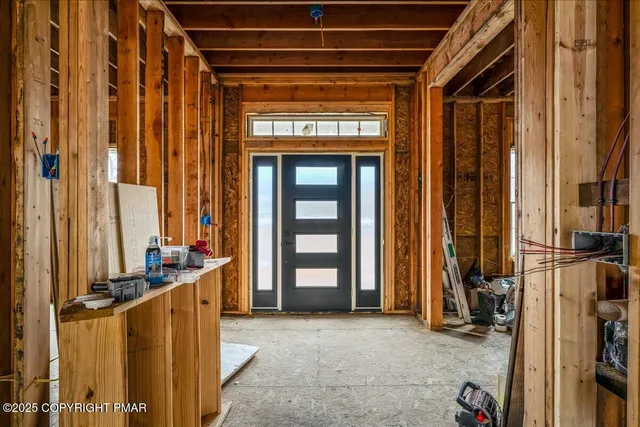 a view of an entryway with a door