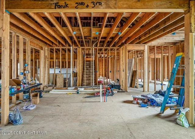 a view of an empty room with windows