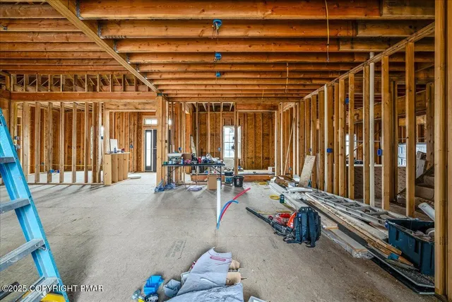 a view of an empty room with wooden walls
