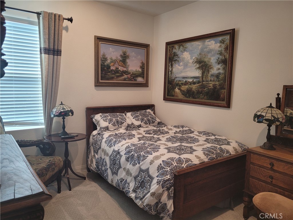 7561 Baerss Road Riverside, CA 92507 - Photo 15 of 27 a bedroom with a bed and painting on the wall