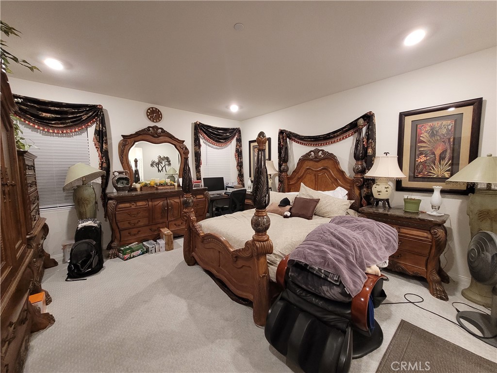 7561 Baerss Road Riverside, CA 92507 - Photo 17 of 27 a bedroom with bed and window