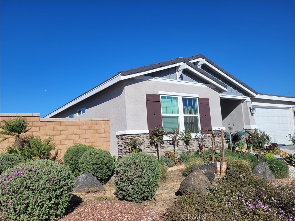 7561 Baerss Road Riverside, CA 92507 - Photo 2 of 27 a front view of a house with garden