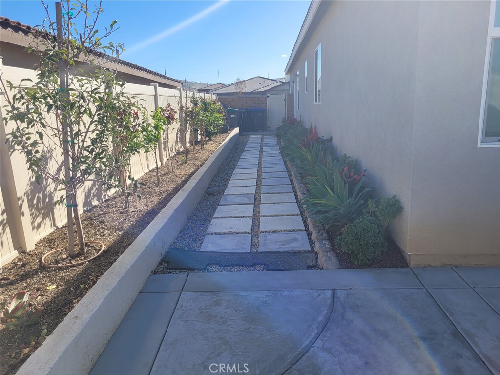 7561 Baerss Road Riverside, CA 92507 - Photo 23 of 27 a view of a pathway both side of house