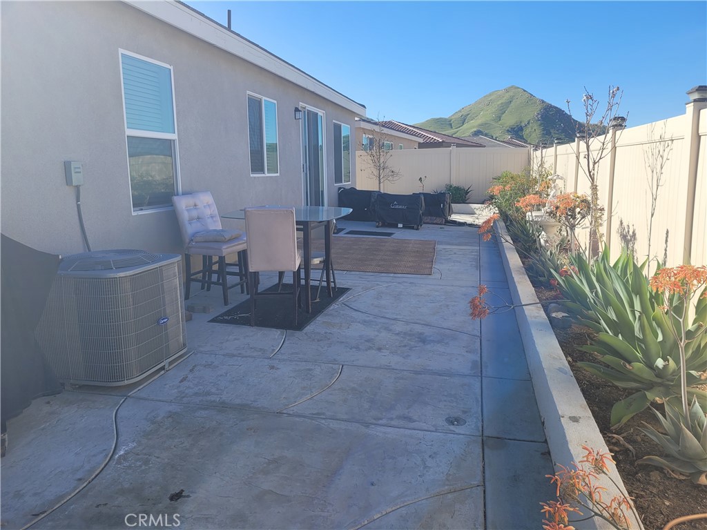 7561 Baerss Road Riverside, CA 92507 - Photo 24 of 27 a view of a patio with couches under an umbrella