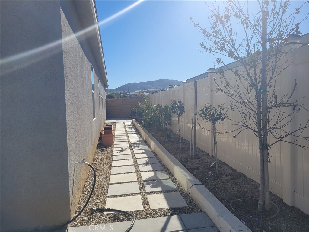 7561 Baerss Road Riverside, CA 92507 - Photo 25 of 27 a view of a balcony with wooden floor and fence