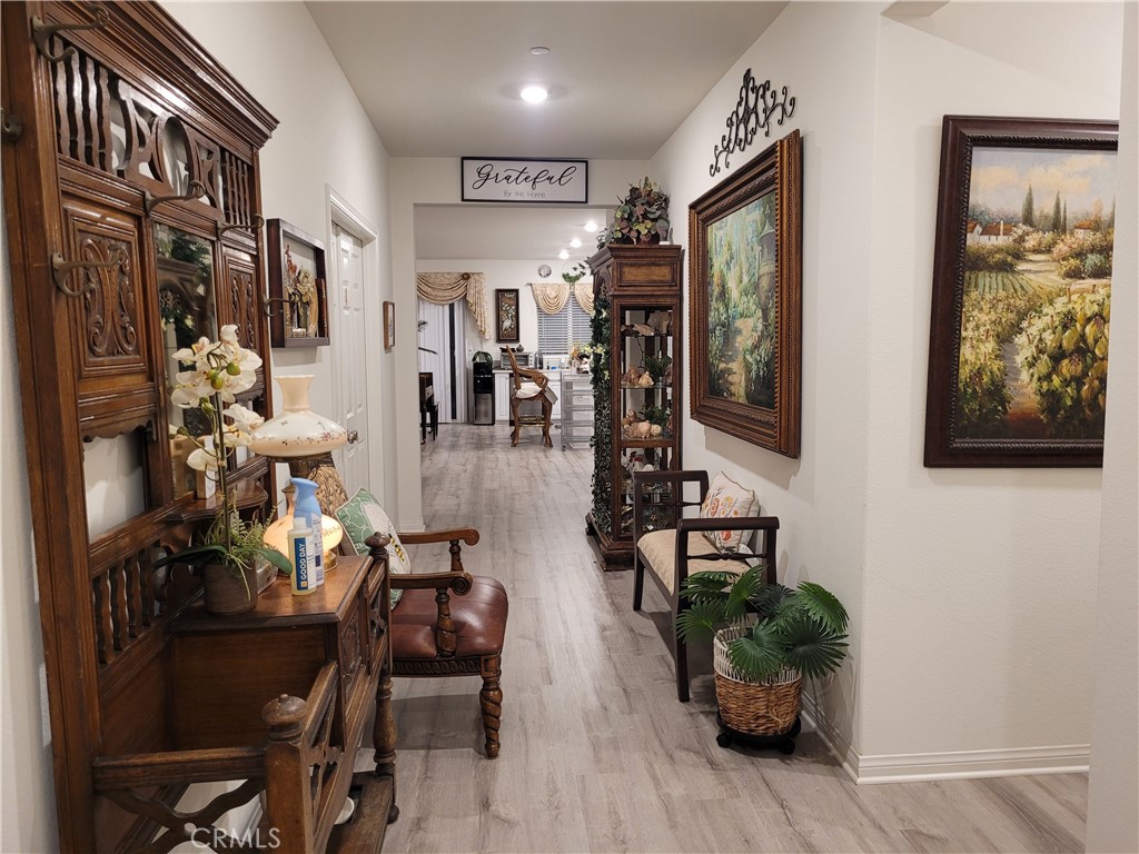 7561 Baerss Road Riverside, CA 92507 - Photo 4 of 27 a living room with furniture and wooden floor