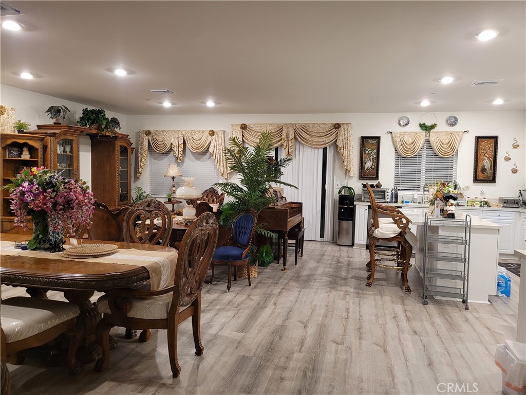 7561 Baerss Road Riverside, CA 92507 - Photo 5 of 27 a view of a dining room with furniture and wooden floor
