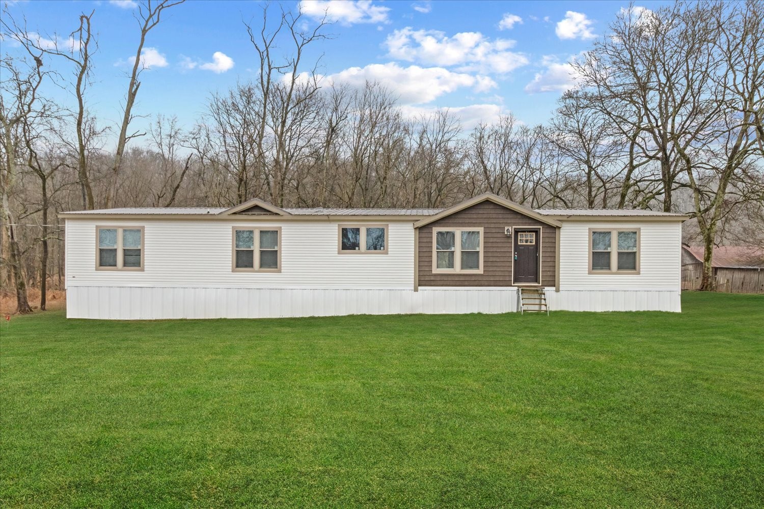 1189 Chicken Creek Road Pulaski, TN 38478 - Photo 2 of 30 a house view with a garden space