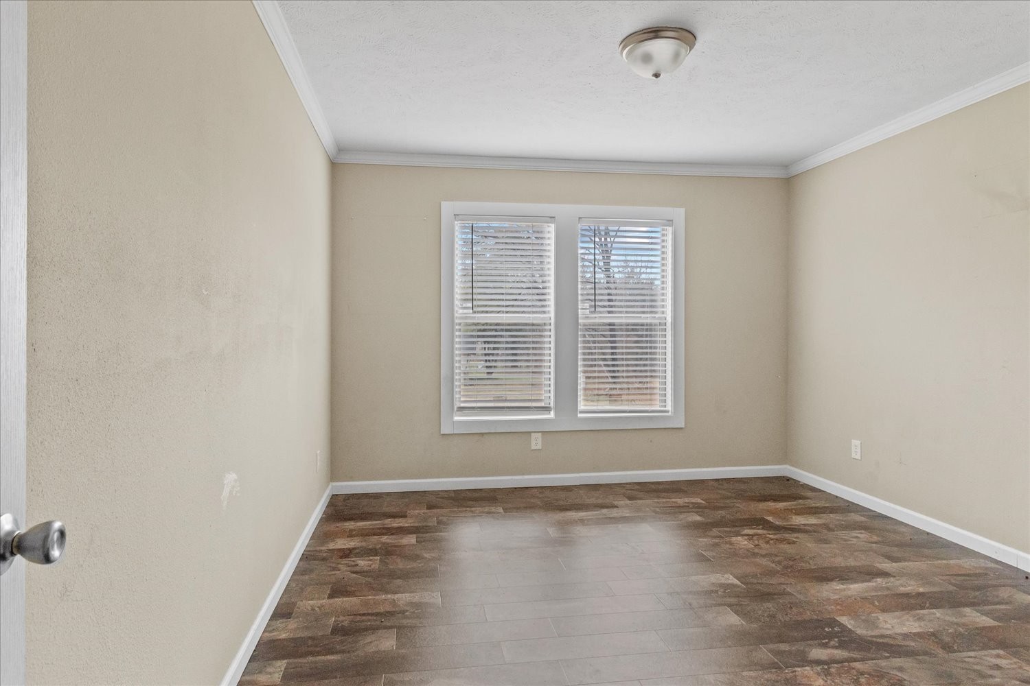1189 Chicken Creek Road Pulaski, TN 38478 - Photo 26 of 30 a view of an empty room with wooden floor and a window