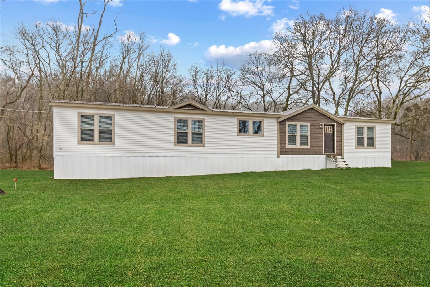 1189 Chicken Creek Road Pulaski, TN 38478 - Photo 3 of 30 a front view of a house with a garden