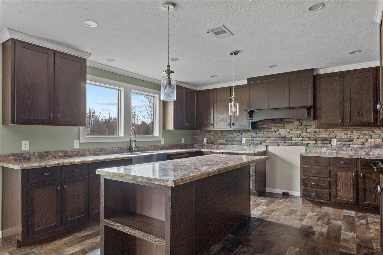 1189 Chicken Creek Road Pulaski, TN 38478 - Photo 7 of 30 a kitchen with a sink stove and cabinets