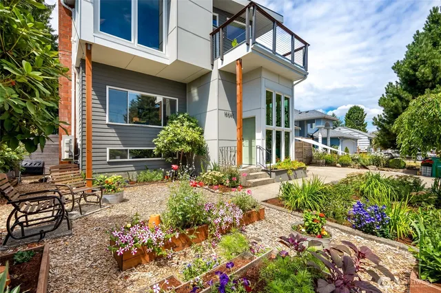 a view of a house with a yard and garden
