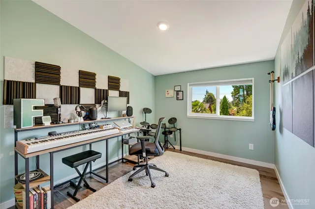 a view of a workspace with furniture and a workspace