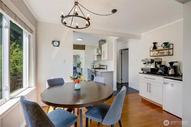 a view of a dining room with furniture window and outside view