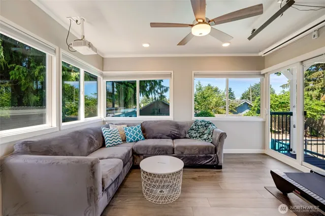 a living room with furniture and a large window