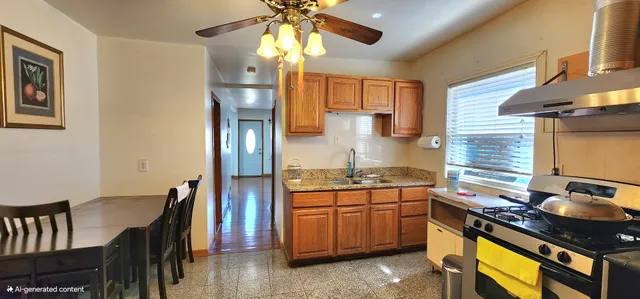 a kitchen with a sink appliances and cabinets