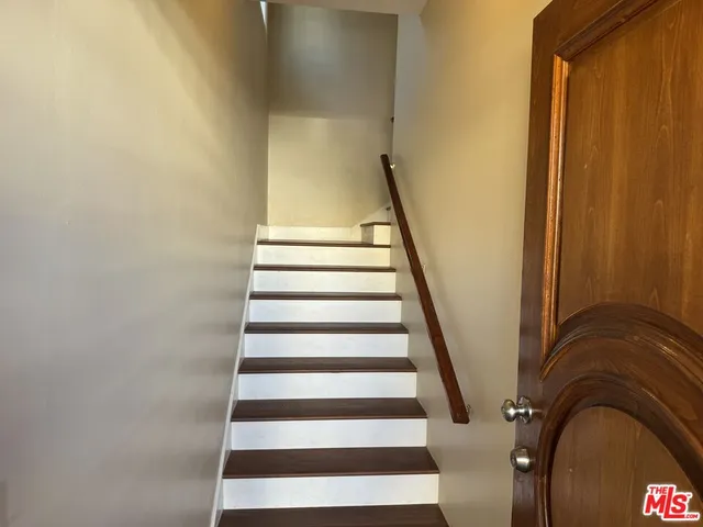 a bathroom with a sink toilet and a mirror