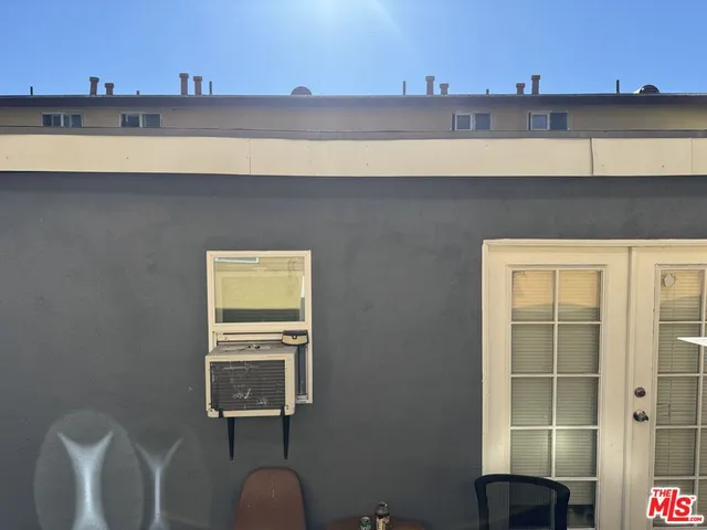 a view of a dresser with sitting area