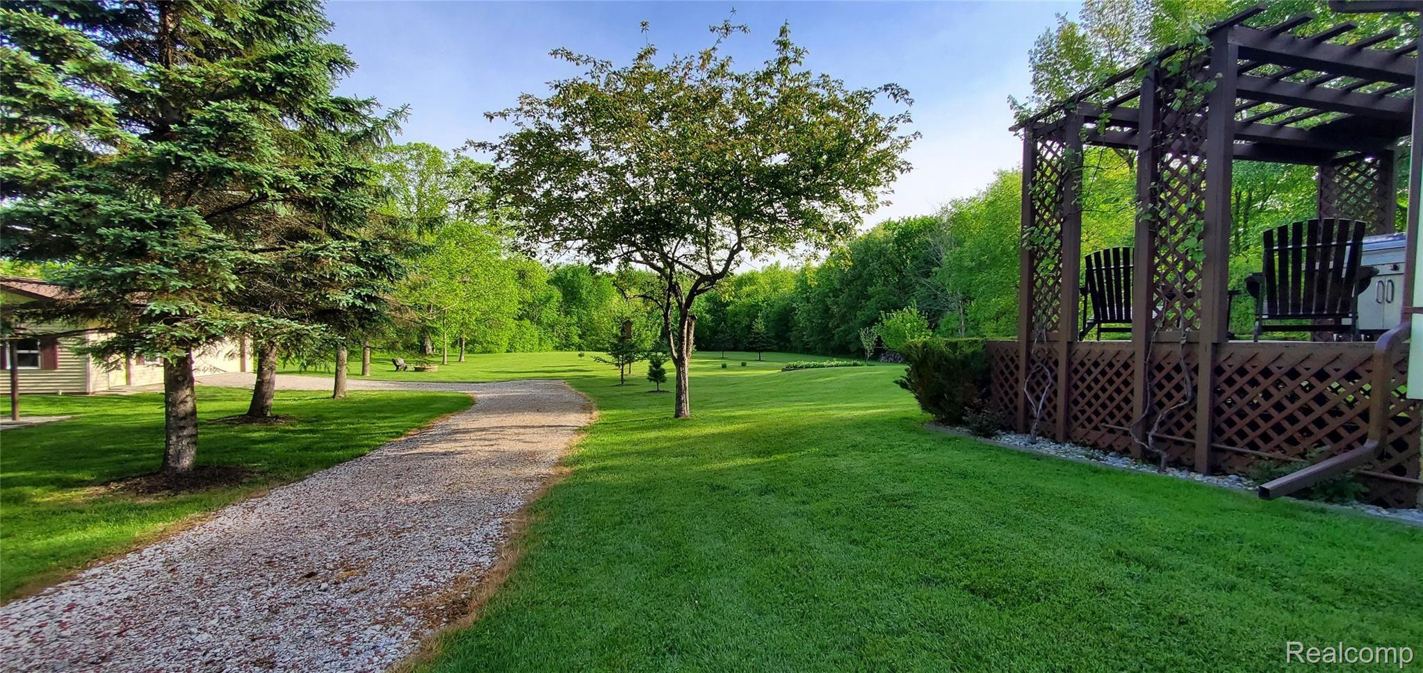 5520 Lowe Road Fowlerville, MI 48836 - Photo 13 of 86 5520 West Lowe Rd View of relaxing backyard