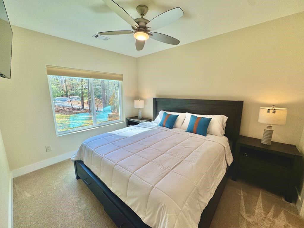1001 Sunset Road Epworth, GA 30541 - Photo 14 of 34 a bedroom with a bed and window