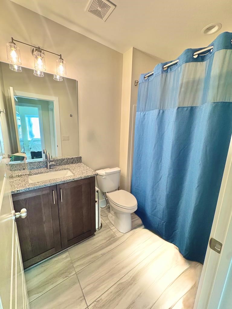 1001 Sunset Road Epworth, GA 30541 - Photo 16 of 34 a bathroom with a sink a toilet and shower