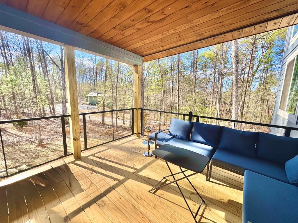 1001 Sunset Road Epworth, GA 30541 - Photo 17 of 34 a living room with large windows and furniture