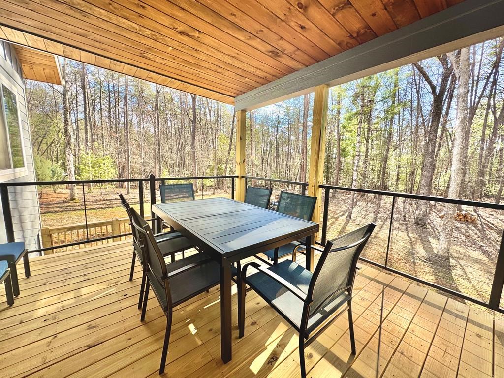 1001 Sunset Road Epworth, GA 30541 - Photo 18 of 34 a view of a dining room with furniture and wooden floor