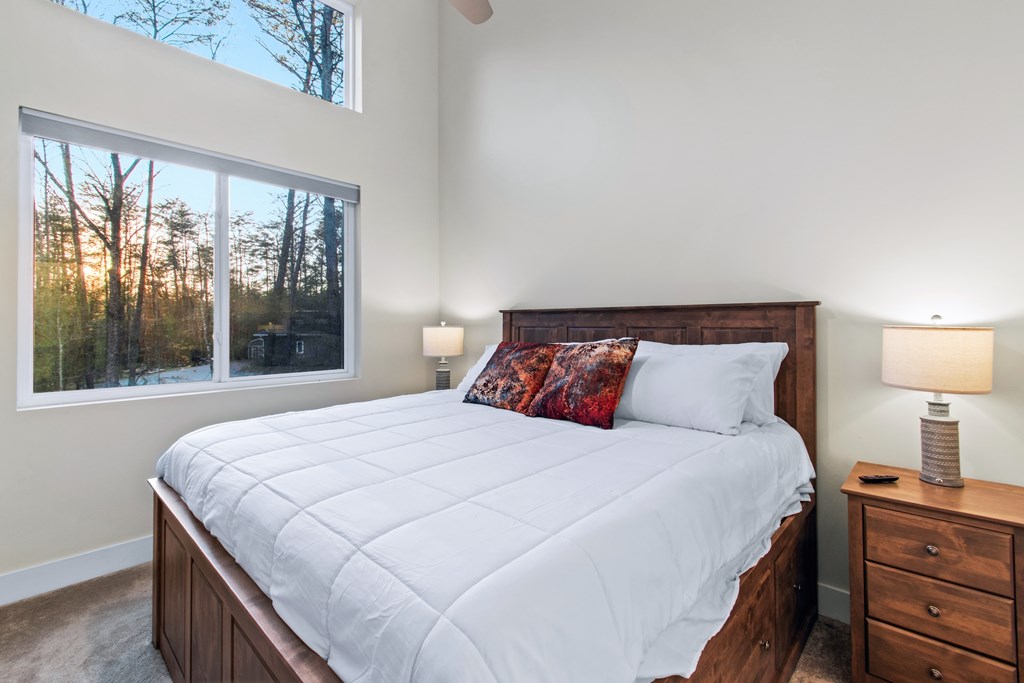 1001 Sunset Road Epworth, GA 30541 - Photo 22 of 34 a bedroom with a large bed and a large window