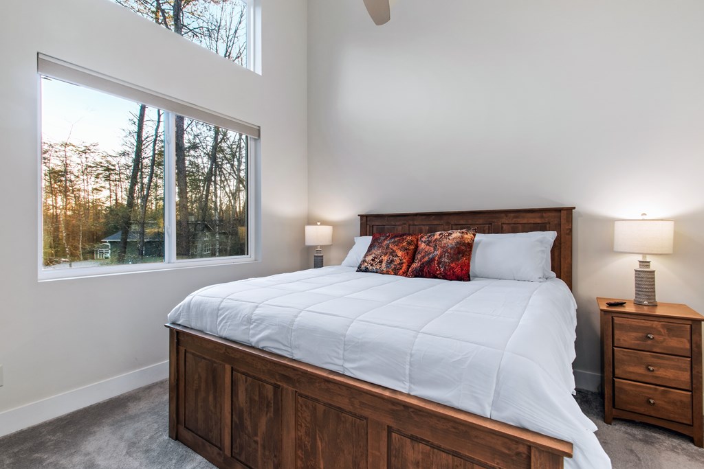 1001 Sunset Road Epworth, GA 30541 - Photo 23 of 34 a bedroom with a large bed and a large window