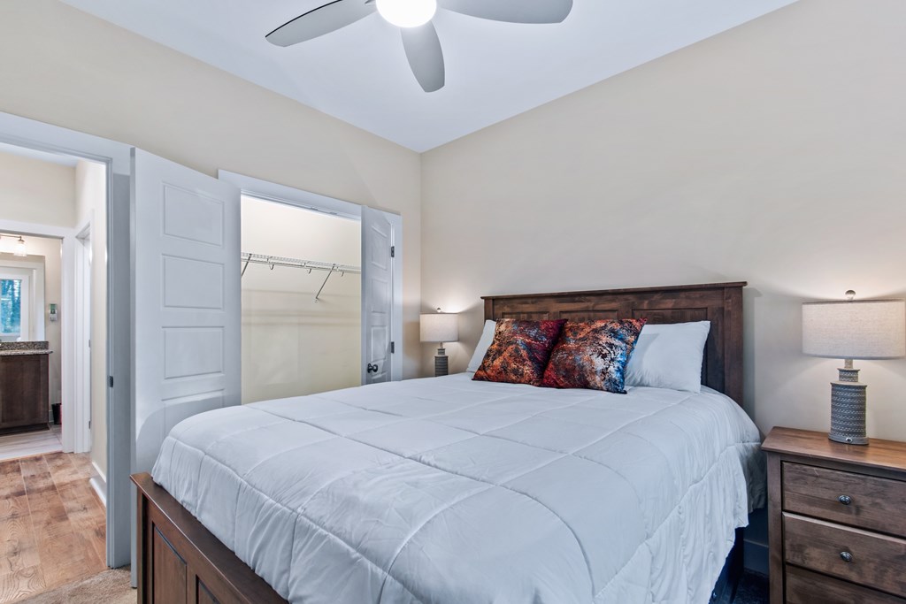 1001 Sunset Road Epworth, GA 30541 - Photo 30 of 34 a bedroom with a bed and a lamp