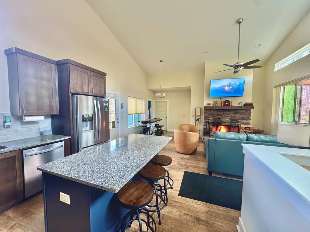1001 Sunset Road Epworth, GA 30541 - Photo 6 of 34 a kitchen with stainless steel appliances granite countertop a stove refrigerator and a sink