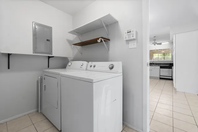 a utility room with dryer and washer