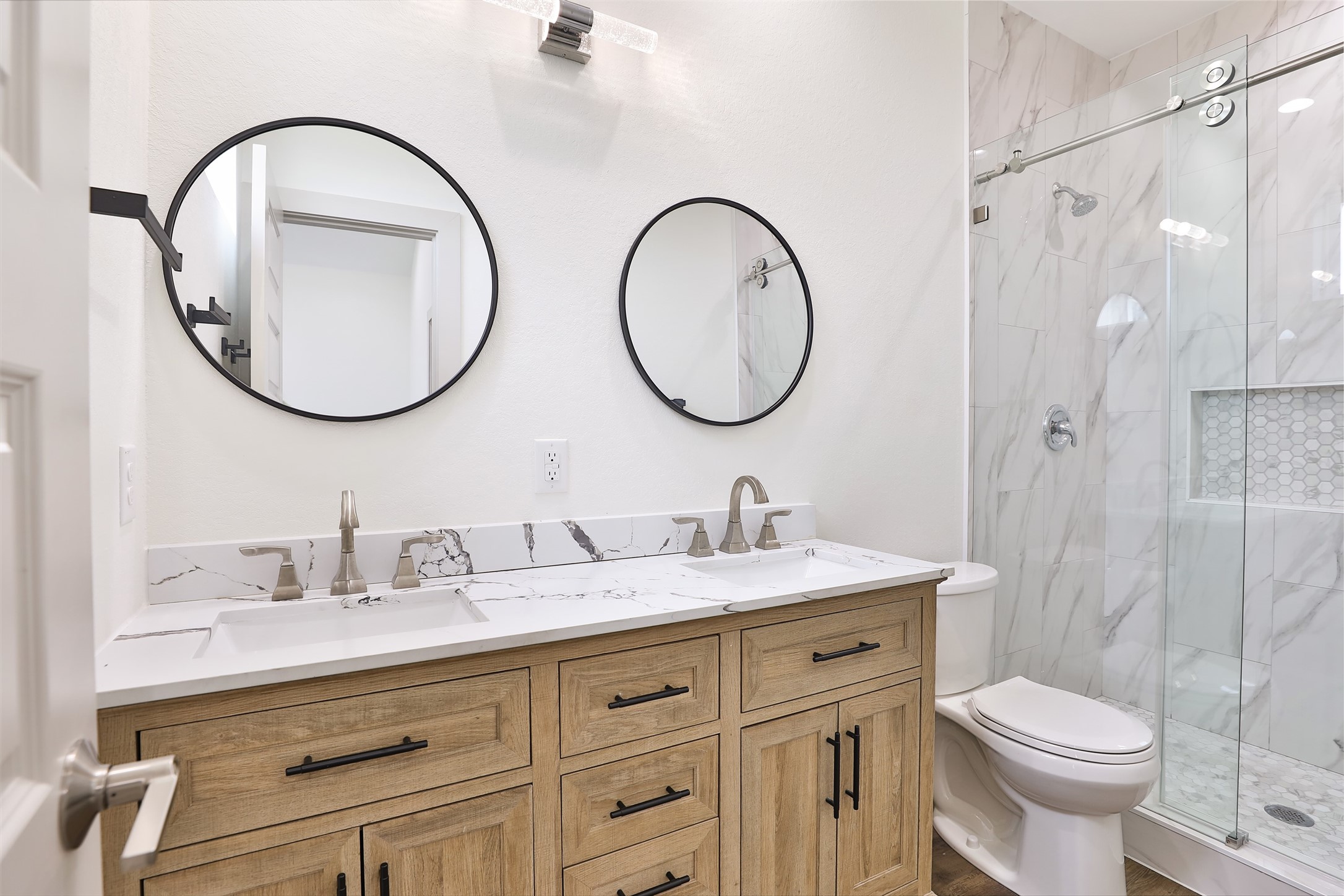 7924 Booker Street, Unit B Houston, TX 77028 - Photo 11 of 19 a bathroom with a toilet a sink and a mirror